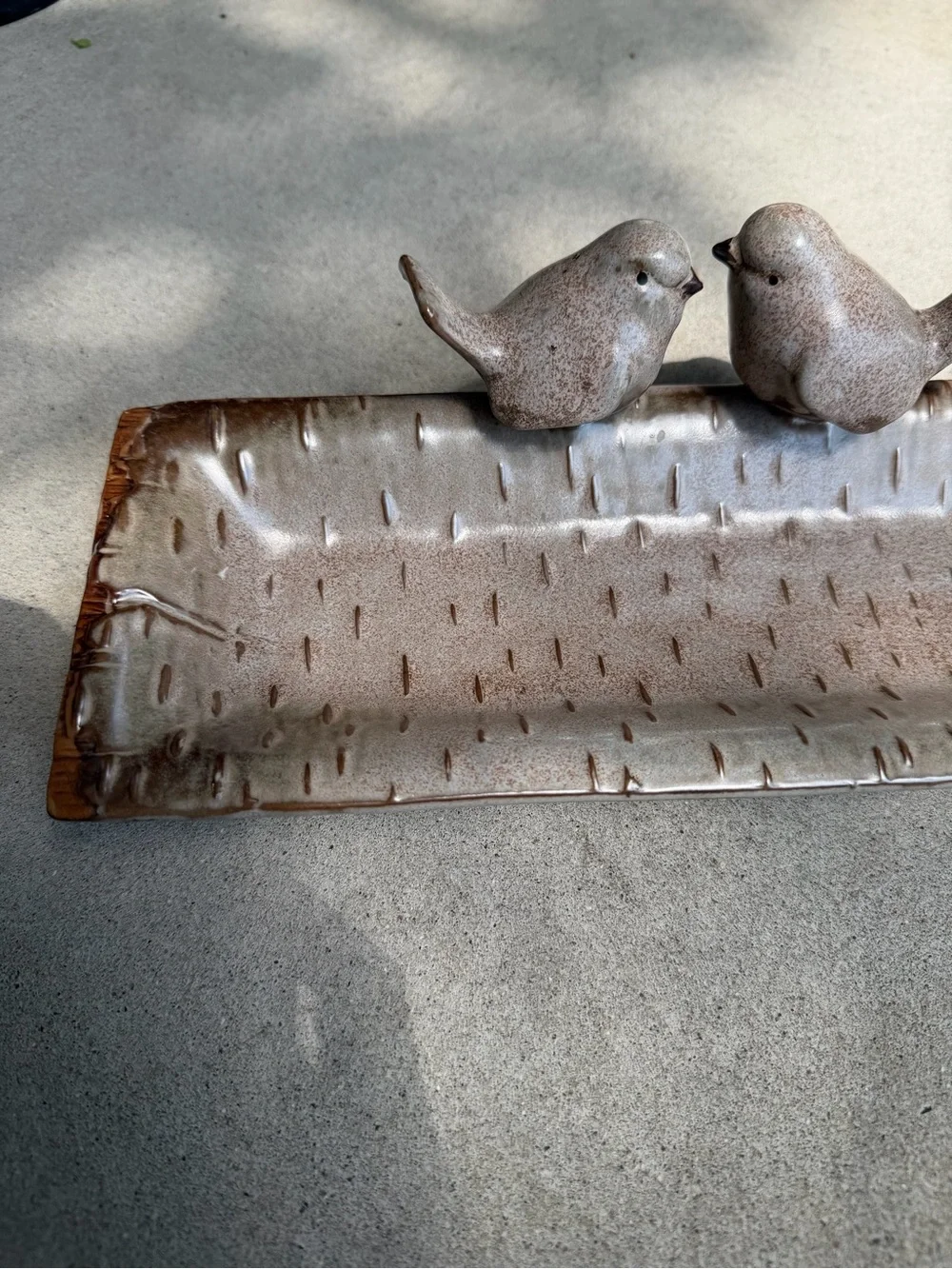Ceramic bird feeder/tray.